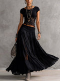 Geneva · Set consisting of a transparent top with black lace panels and a maxi pleated skirt